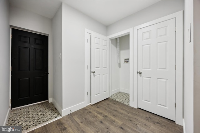 entrance foyer featuring dark hardwood / wood-style flooring