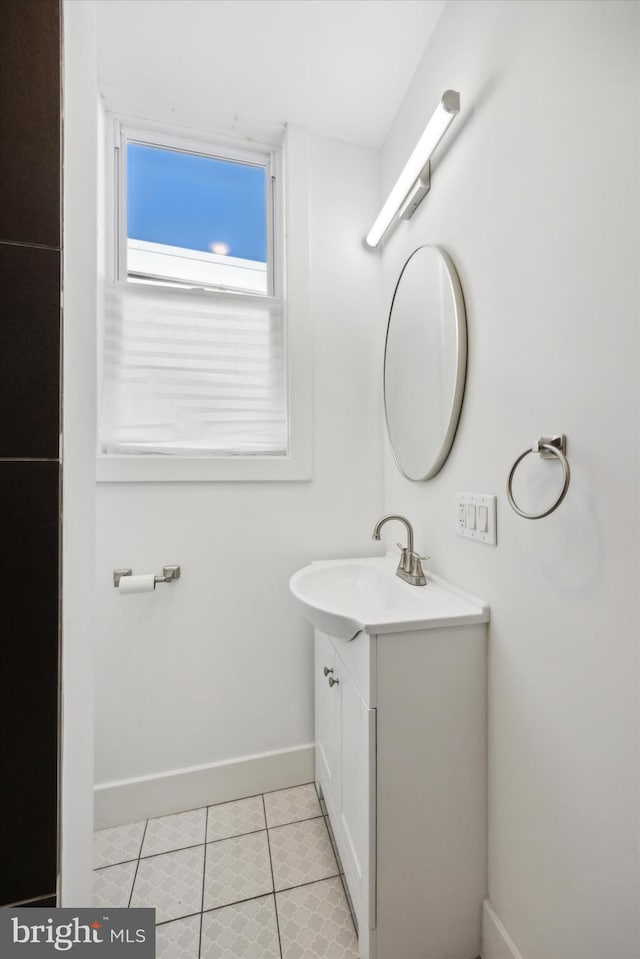 bathroom with vanity and tile patterned flooring