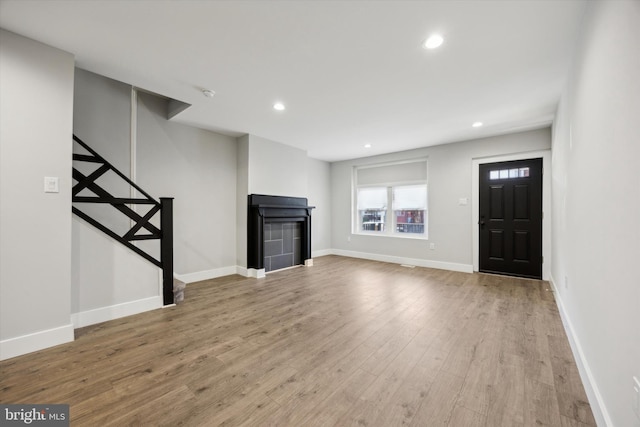 unfurnished living room with hardwood / wood-style floors