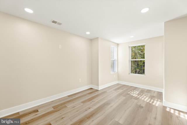 unfurnished room featuring light wood-type flooring