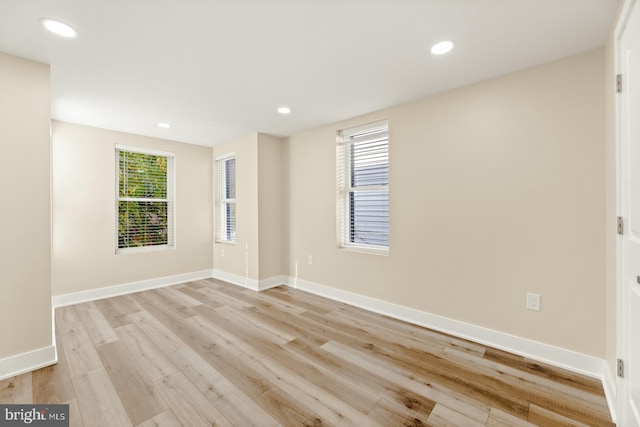 unfurnished room featuring light hardwood / wood-style floors