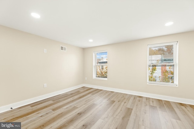 unfurnished room featuring light wood-type flooring