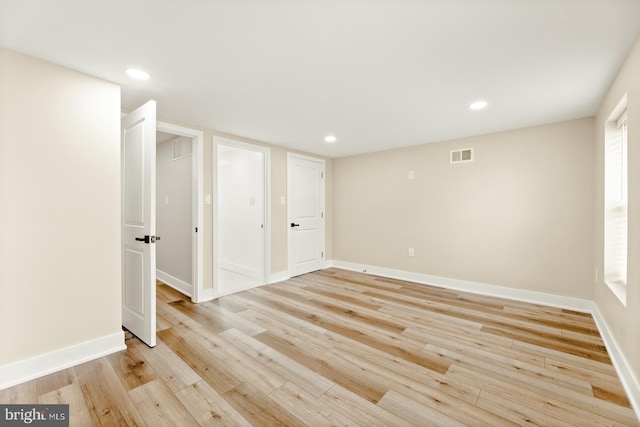 spare room featuring light hardwood / wood-style flooring