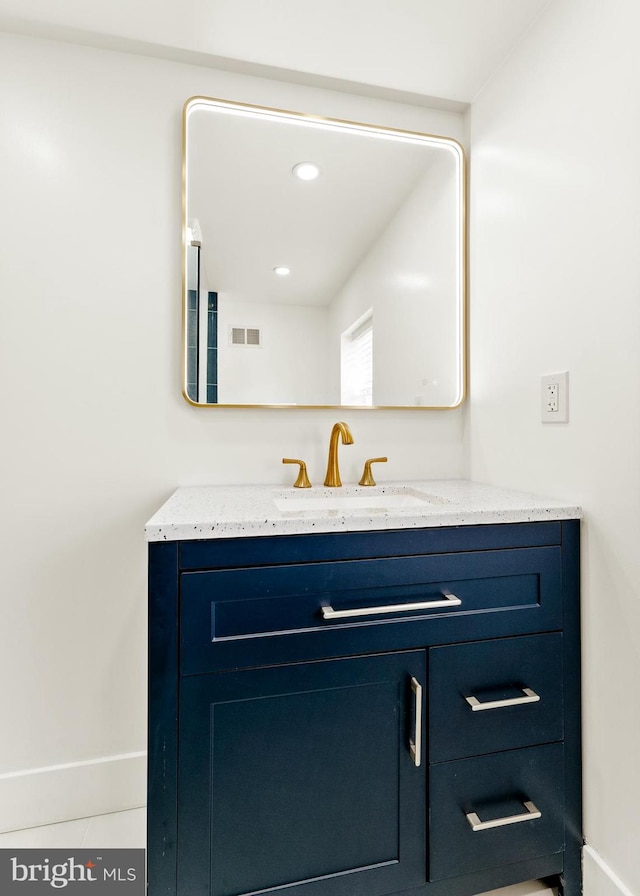 bathroom with vanity and tile patterned floors