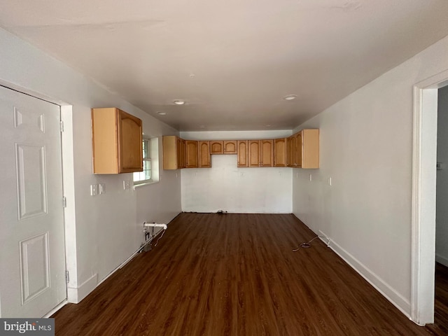 laundry room with dark hardwood / wood-style floors