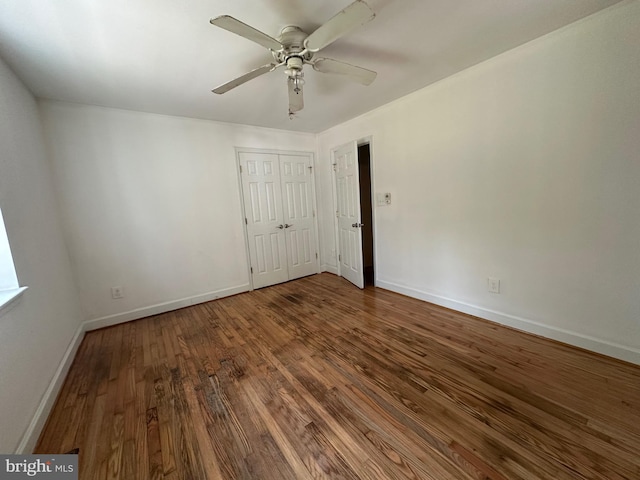 spare room with hardwood / wood-style floors and ceiling fan