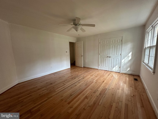 unfurnished bedroom featuring light hardwood / wood-style flooring and ceiling fan