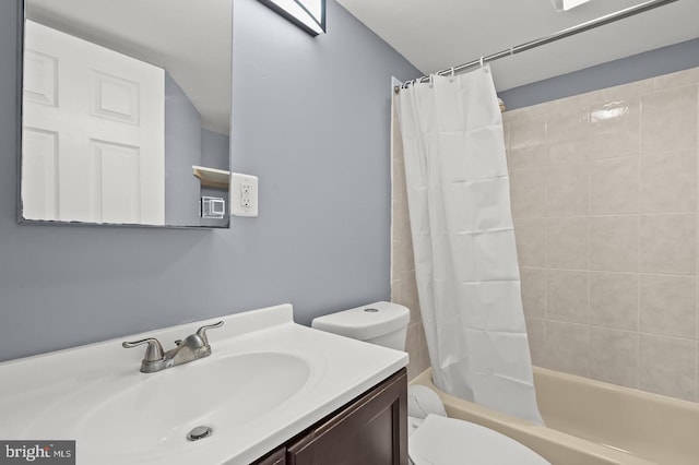 full bathroom featuring shower / tub combo, vanity, and toilet