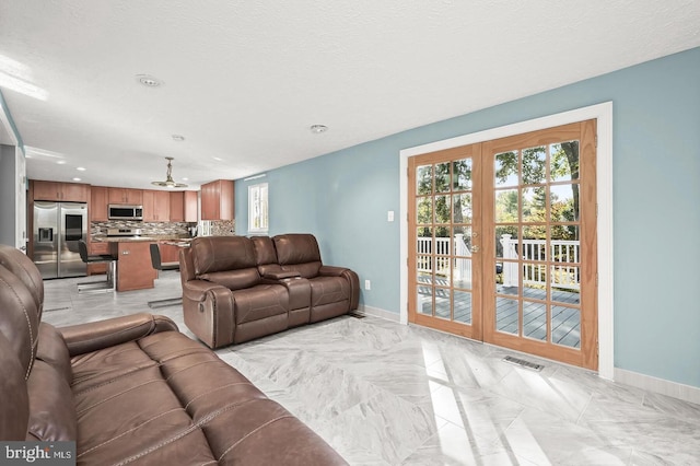 tiled living room with a textured ceiling