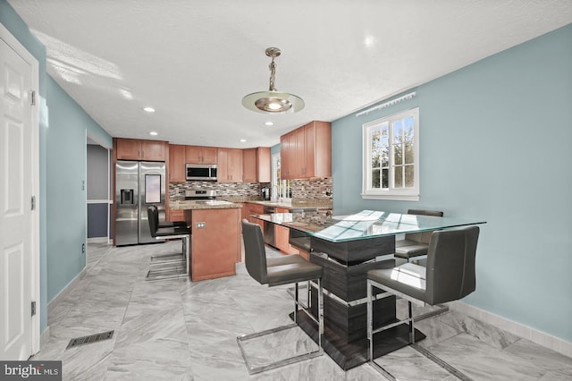 dining area with a textured ceiling