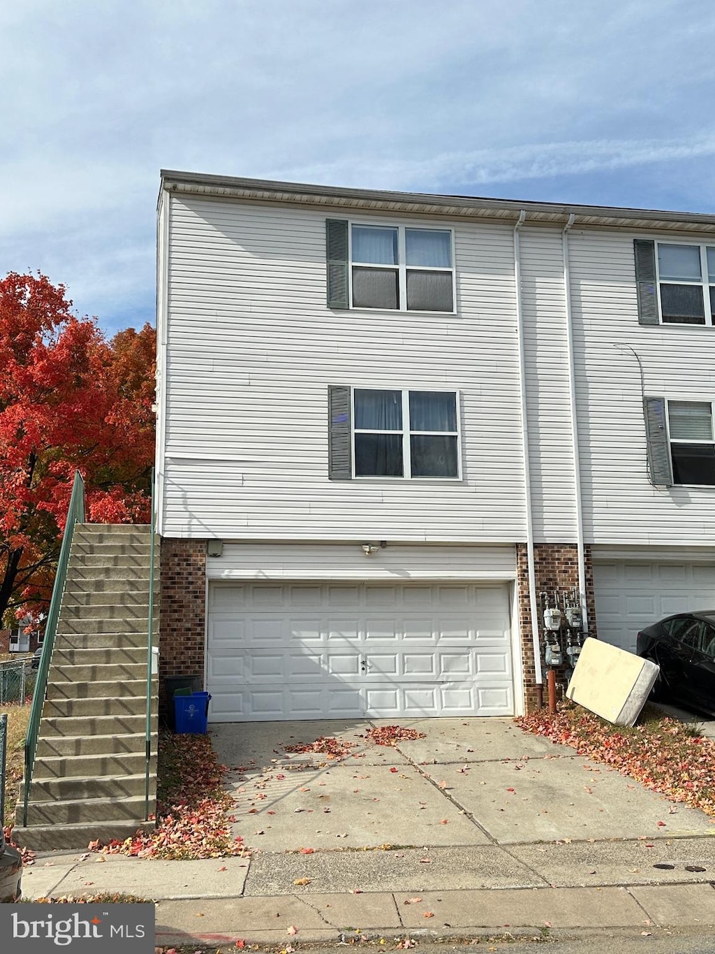 view of side of home with a garage