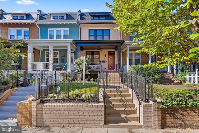 townhome / multi-family property featuring covered porch