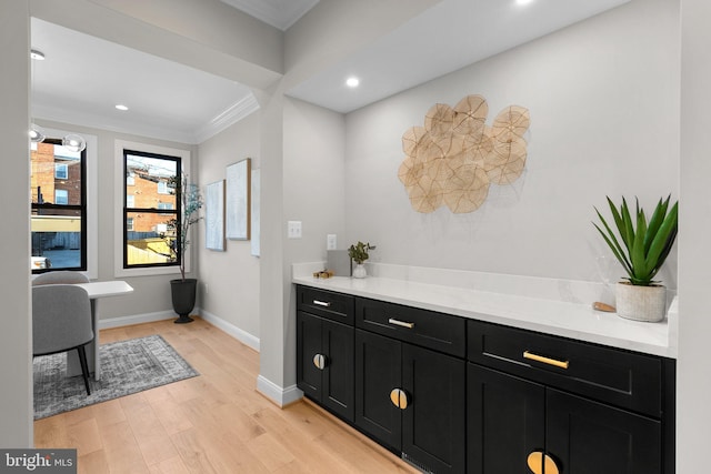 interior space with light hardwood / wood-style flooring and ornamental molding