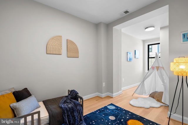 recreation room featuring hardwood / wood-style flooring