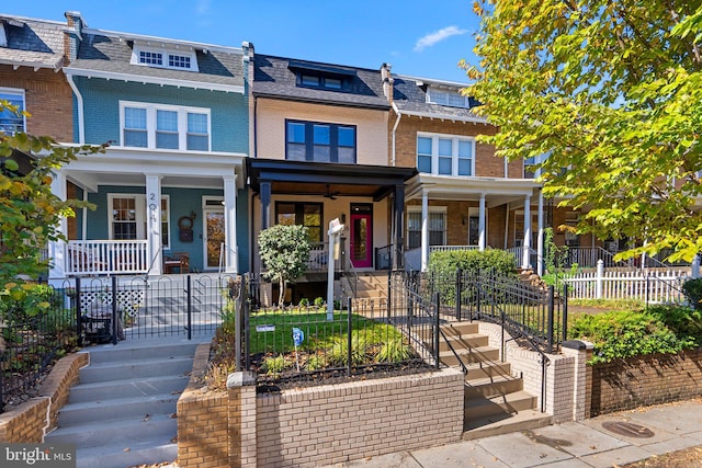 townhome / multi-family property with covered porch