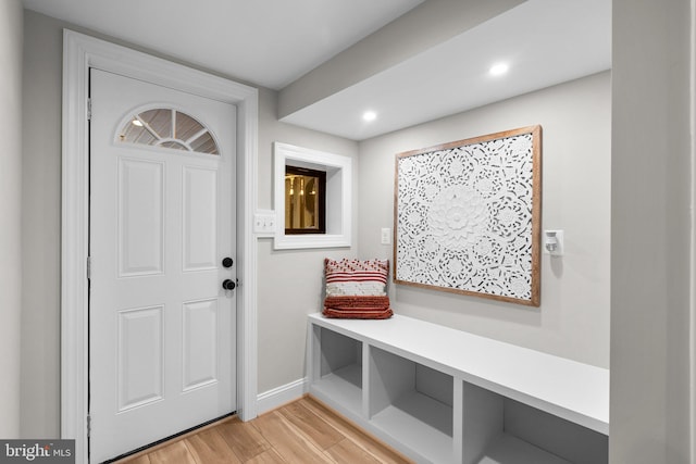 mudroom with light hardwood / wood-style flooring