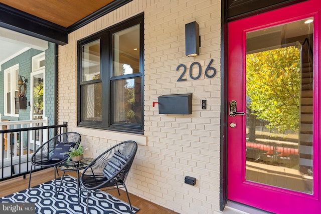 doorway to property with a porch