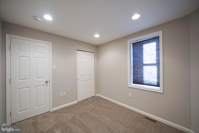 unfurnished bedroom with carpet flooring