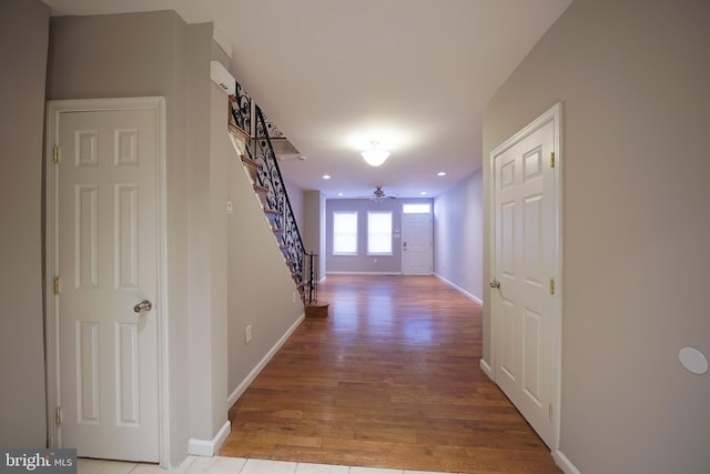 corridor with light wood-type flooring