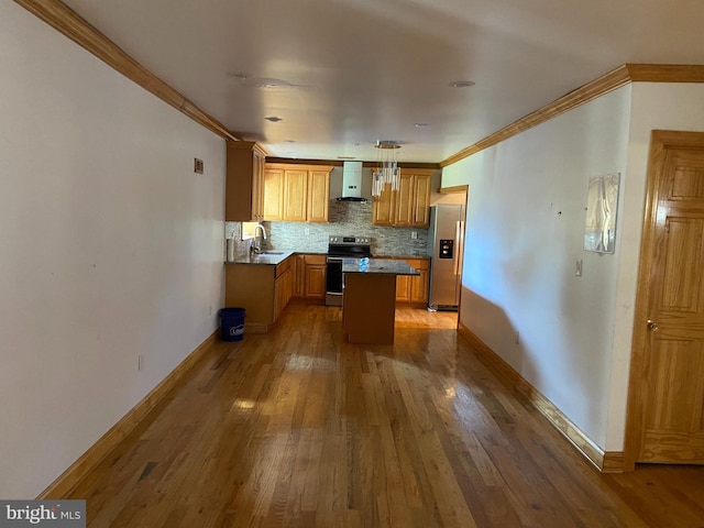 kitchen featuring hardwood / wood-style floors, a kitchen island, sink, pendant lighting, and stainless steel appliances