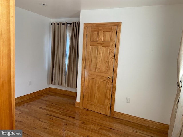 empty room with light wood-type flooring