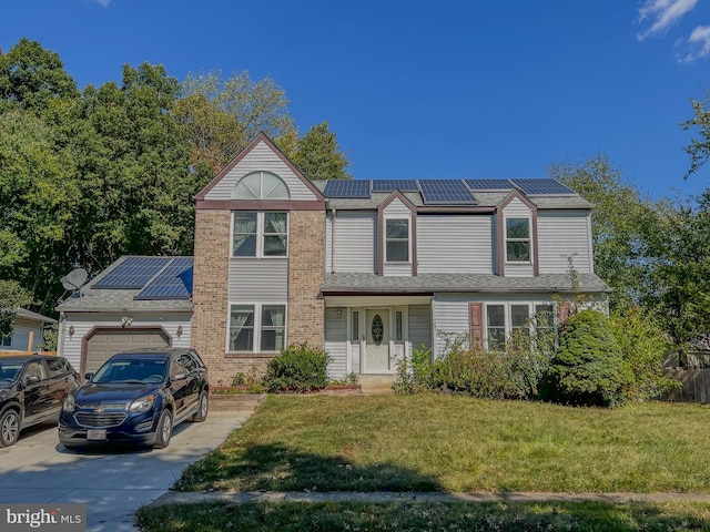 view of front of property with solar panels, a front yard, and a garage