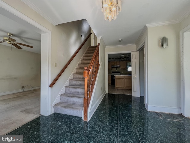 stairs featuring carpet, ornamental molding, and ceiling fan with notable chandelier