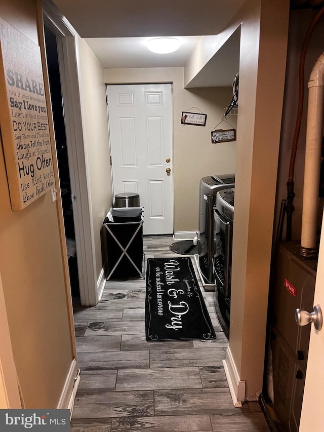 5437 Force Rd, Baltimore, MD 21206 - laundry area with washing machine and clothes dryer, wood finished floors, and baseboards