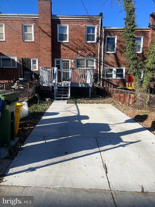 back of property with a wooden deck