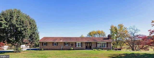 ranch-style home with a front yard