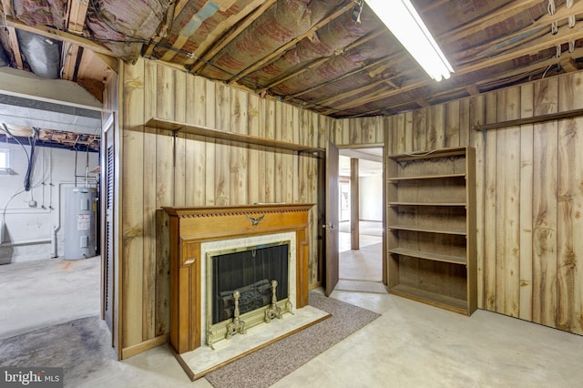 living room with water heater and concrete flooring