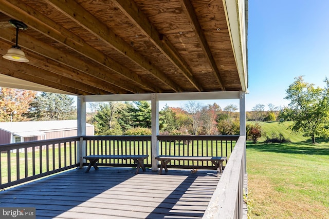 wooden terrace with a yard