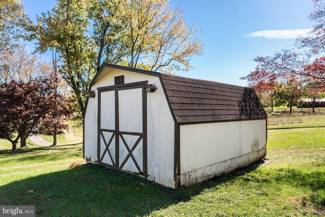 view of outdoor structure with a lawn