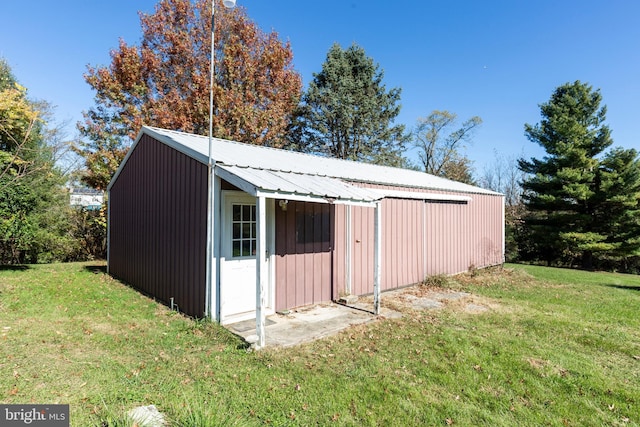 view of outbuilding with a lawn