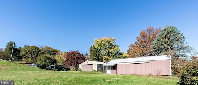 view of yard featuring a garage