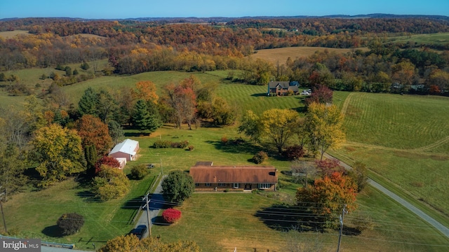 birds eye view of property with a rural view