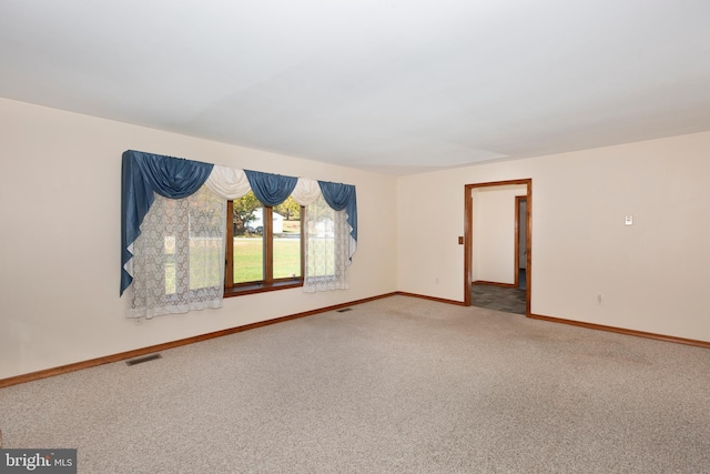 unfurnished room featuring carpet floors