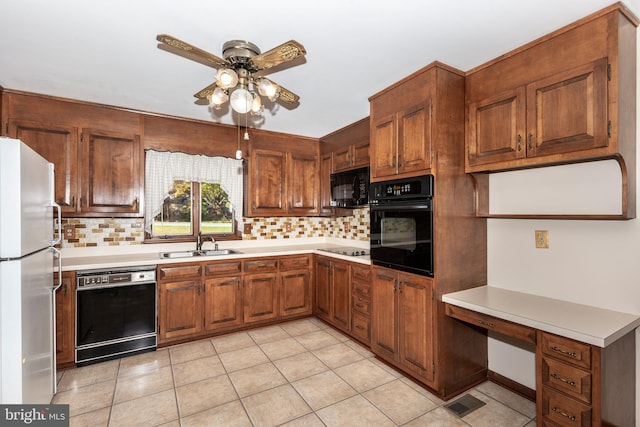 kitchen featuring backsplash, black appliances, light tile patterned flooring, and ceiling fan