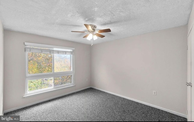 carpeted empty room featuring a textured ceiling and ceiling fan