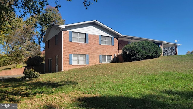 view of property exterior featuring a lawn