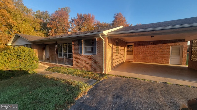 view of front of home featuring a carport