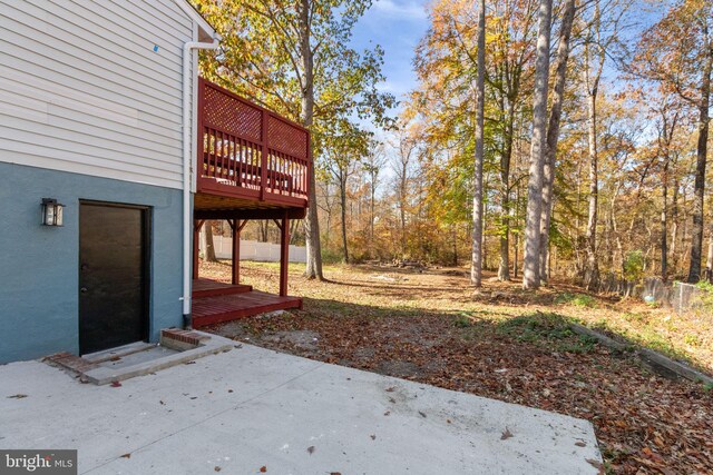 view of yard featuring a patio area and a deck