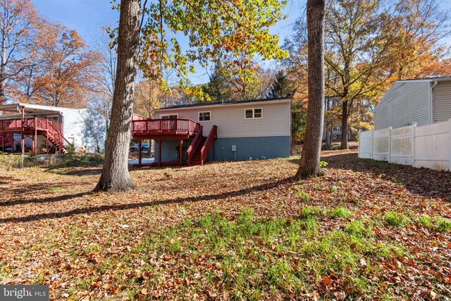 back of property featuring a wooden deck