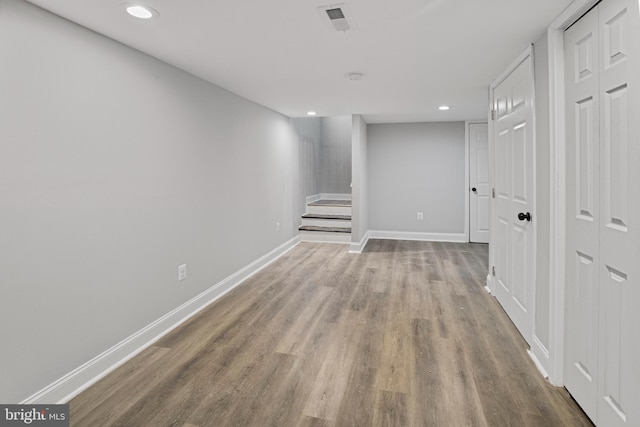 basement featuring light hardwood / wood-style floors