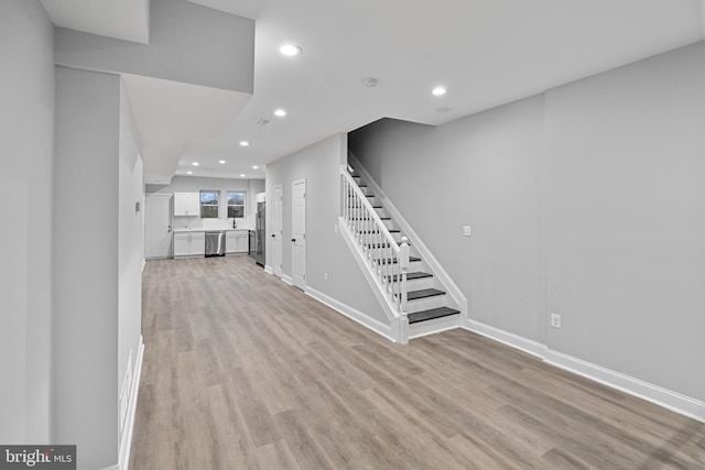 unfurnished living room with light hardwood / wood-style flooring