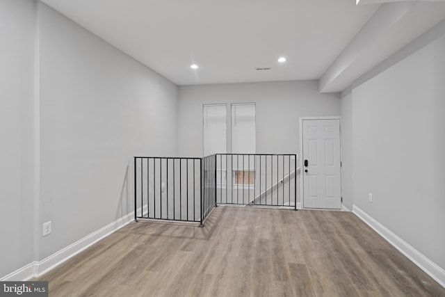 unfurnished room with light hardwood / wood-style flooring