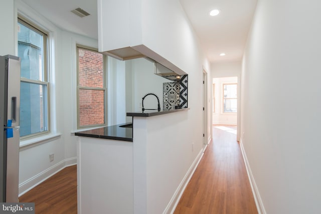 hall featuring wood-type flooring