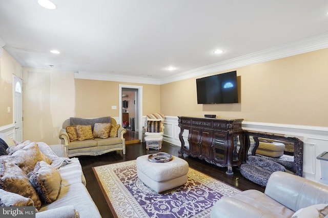 living room with dark hardwood / wood-style flooring and ornamental molding