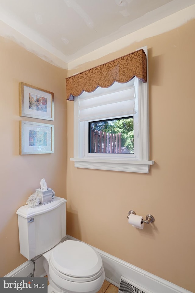 bathroom featuring tile patterned floors and toilet