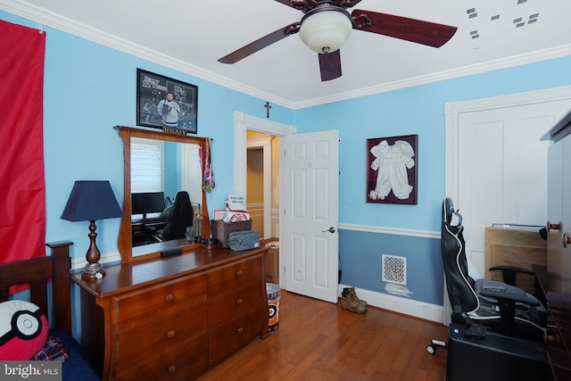 office space with ornamental molding, dark hardwood / wood-style floors, and ceiling fan